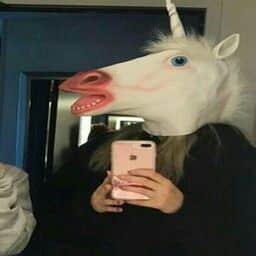 Selfie with a white horse head mask