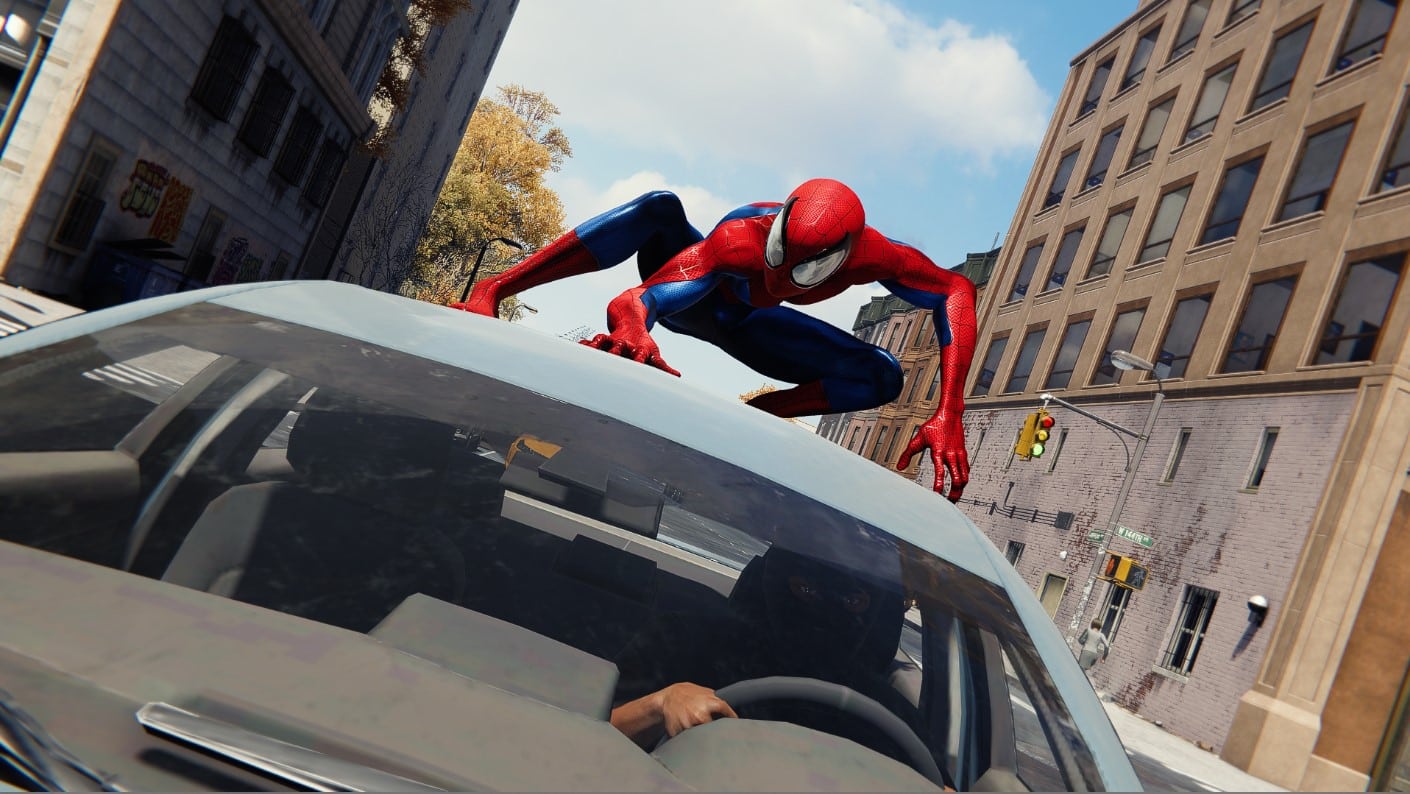 Ultimate Spider-Man landing on a car in an action sequence