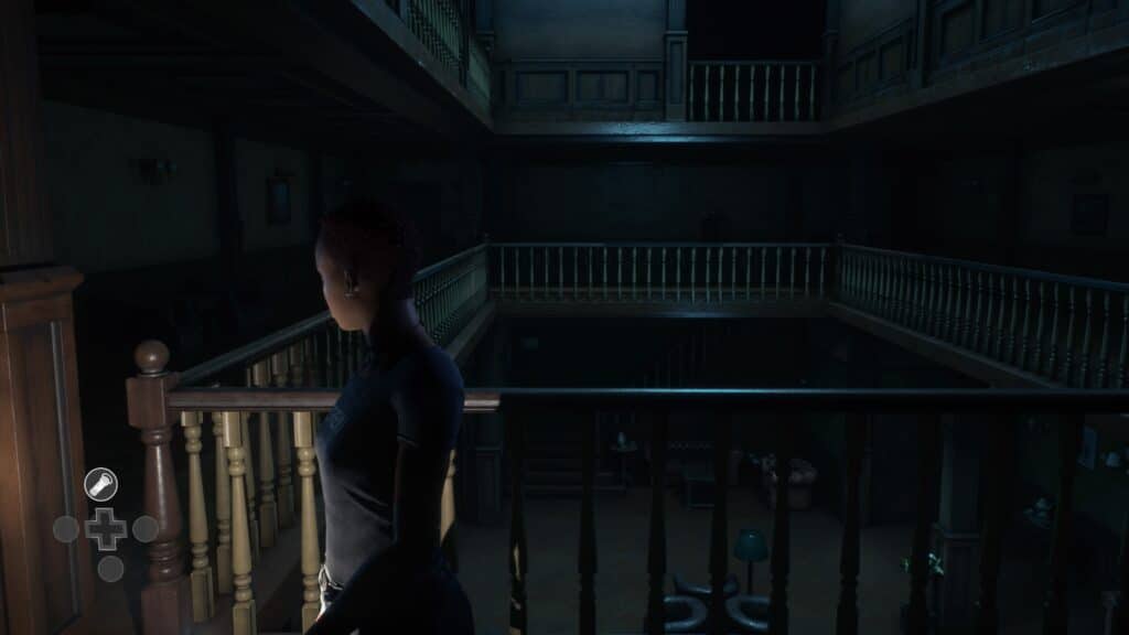 The Devil In Me Screenshot showing Jamie looking at a staircase
