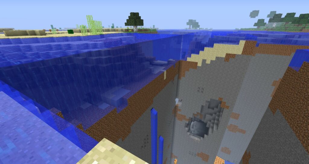 A missing chunk in a Minecraft world with a cave and water that isn't flowing.