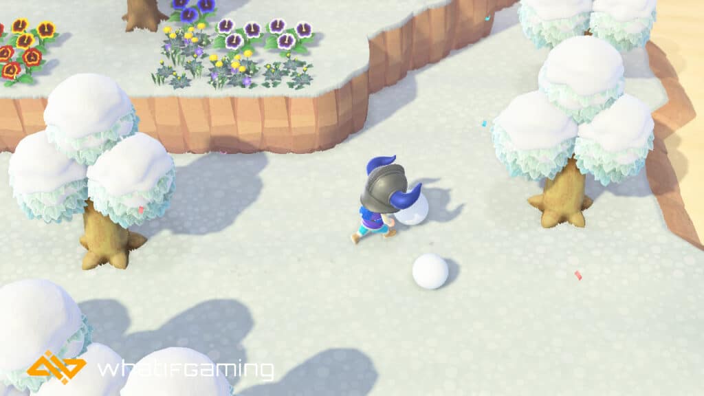 A player pushing snowballs in Animal Crossing