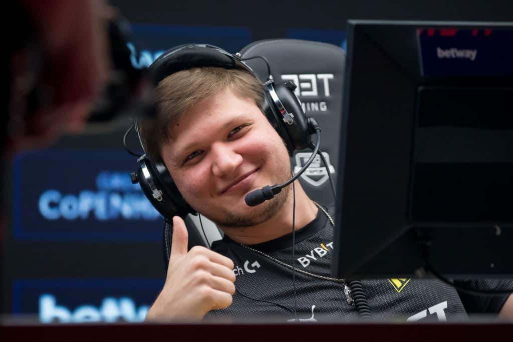 A photo of s1mple throwing up a thumbs up.