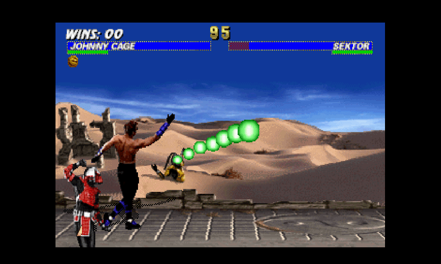 Johnny Cage and Sektor in Mortal Kombat Trilogy. Cyrax can be seen in the background, trapped in the sand.